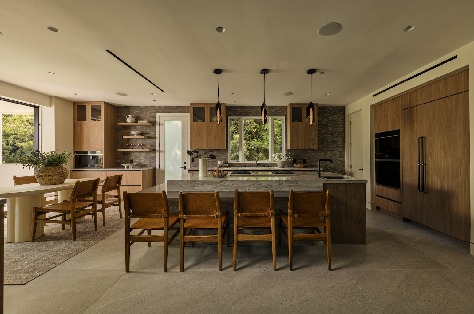 Luxury kitchen with stone island and wood cabinetry